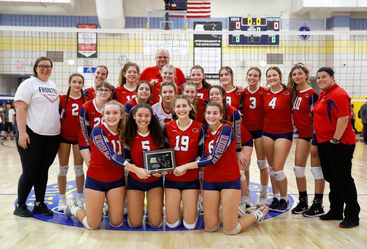 Frontier poses for a team photo with the Western Massachusetts Class B girls volleyball championship trophy after defeating Baystate Academy on Saturday at Chicopee Comp.