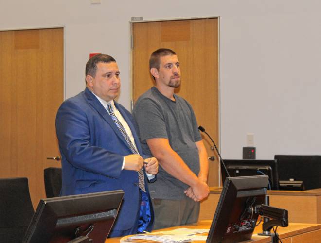 Justin R. Page, right, stands next to defense attorney Isaac Mass in Franklin County Superior Court on Wednesday before pleading guilty to one count of unlawful possession of a firearm and one count of possession of a Class A drug (heroin) with intent to distribute. He was sentenced to three years in prison.