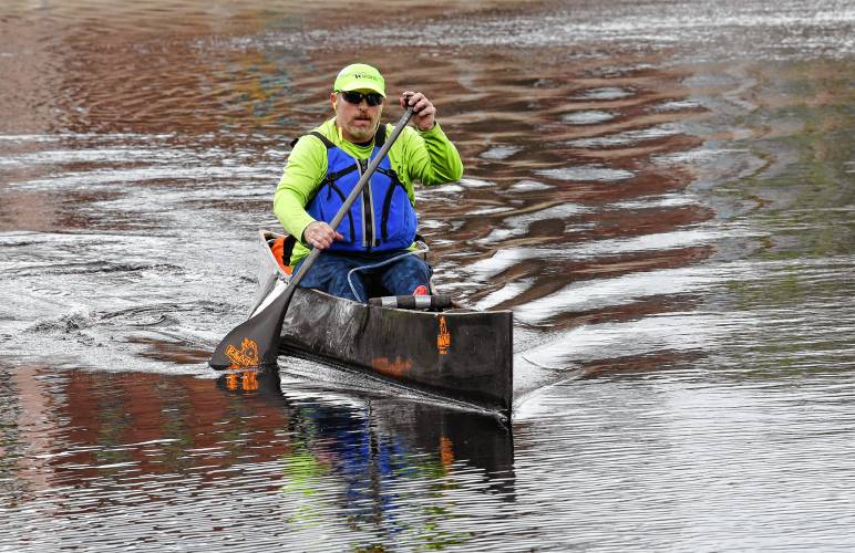 Jerry Whaland of Billy Goat Boats paddles a canoe on the Millers River near his business in Orange in May. Billy Goat Boats might remain at Orange Riverfront Park after the former town administrator took responsibility for a leasing issue that forced the recent eviction of the family-run watercraft rental business.