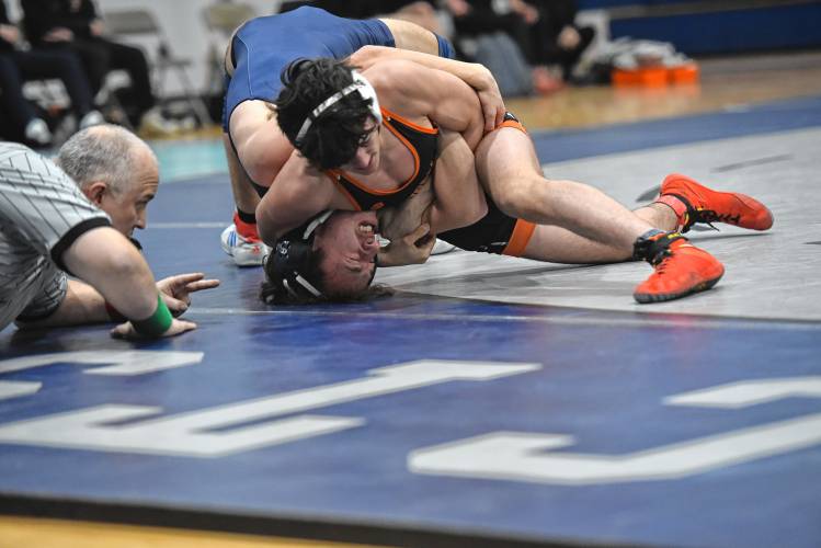 South Hadley’s Logan Luis attempts to get the pin on Franklin Tech’s Madix Whitman on Friday in Turners Falls.  