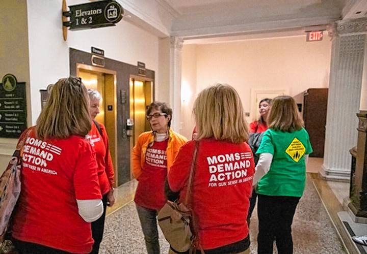 Members of Moms Demand Action stand outside the spectators’ gallery during the ongoing Senate debate on a firearm reforms package on Thursday.