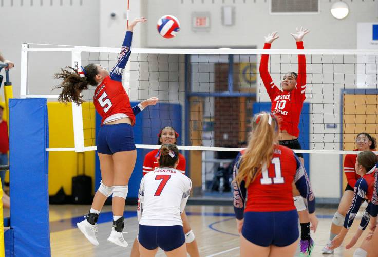Frontier’s Gabrielle Adams (5) hits at the net against Baystate Academy in the second set of the Western Mass. Class B girls volleyball final Saturday at Chicopee Comp.