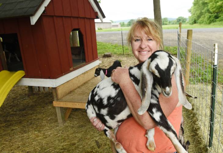 Laurie Cuevas with her goats at Thomas Farm and Dairy in Sunderland. Cuevas will be one of three guest speakers at Saturday’s Pioneer Valley Regional Agricultural Conference to take place at Smith Vocational and Agricultural High School in Northampton.