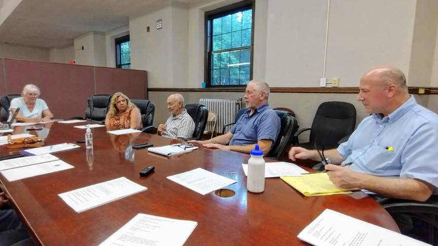 Orange Long Range Comprehensive Planning Committee Chair Tom Sexton (third from right) and committee member Karl Bittenbender (to Sexton’s left) meet with members of Athol’s Downtown Vitality Committee.