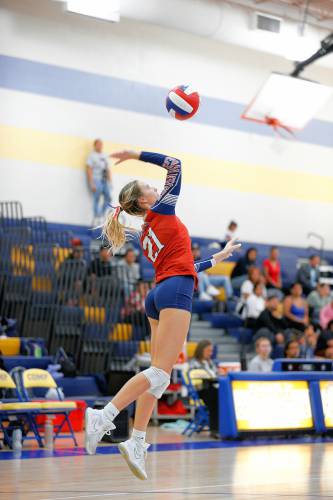 Frontier’s Olivia Machon (21) serves against Baystate Academy in the first set of the Western Mass. Class B girls volleyball final Saturday at Chicopee Comp.
