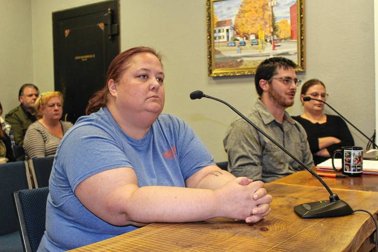 Samantha Whaland, owner of Billy Goat Boats in Orange, stares ahead and listens as Town Administrator Matthew Fortier speaks to the Selectboard at Wednesday’s meeting in Town Hall. The watercraft rental company is at the center of a controversy after being evicted from the East River Street boathouse over a leasing issue.
