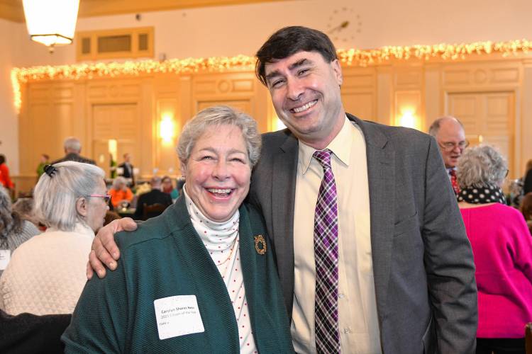 Greenfield Recorder Citizen of the Year Ben Clark, center, with former winner Carolyn Shores Ness at the Citizen of the Year ceremonies at the Franklin County Chamber of Commerce’s holiday breakfast at Deerfield Academy Tuesday morning.
