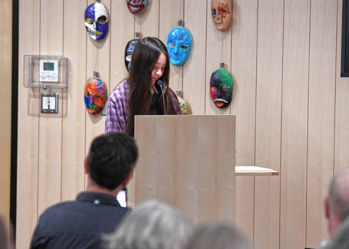 Summit Wicks-Lim, a co-winner in the category for ages 12 to 14, reads two of her poems at the Poet’s Seat Poetry Contest awards ceremony at the Greenfield Public Library on Tuesday evening. 