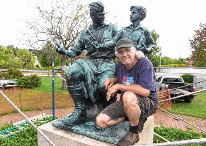Jeffrey Bronnes, owner of Royalston Arts Foundry, with the Massachusetts Peace Statue in Memorial Park in Orange.