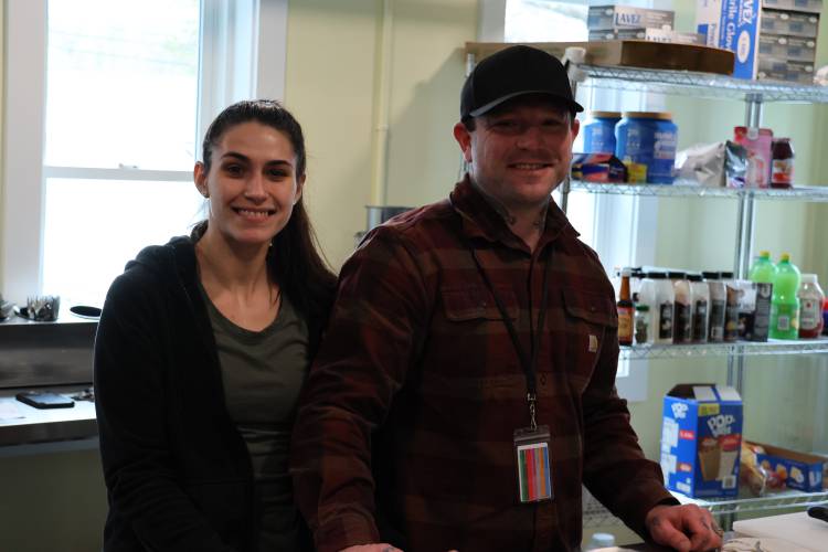 From left, Sabrina Silva and James Winget work on fixing meals at Sunrise Ridge. 