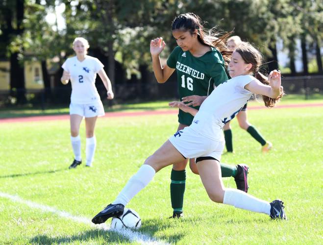 Franklin Tech’s Anne Kolodziej, right, in action last season against Greenfield, scored four goals on Friday against Pathfinder, giving her 50 goals for her career.