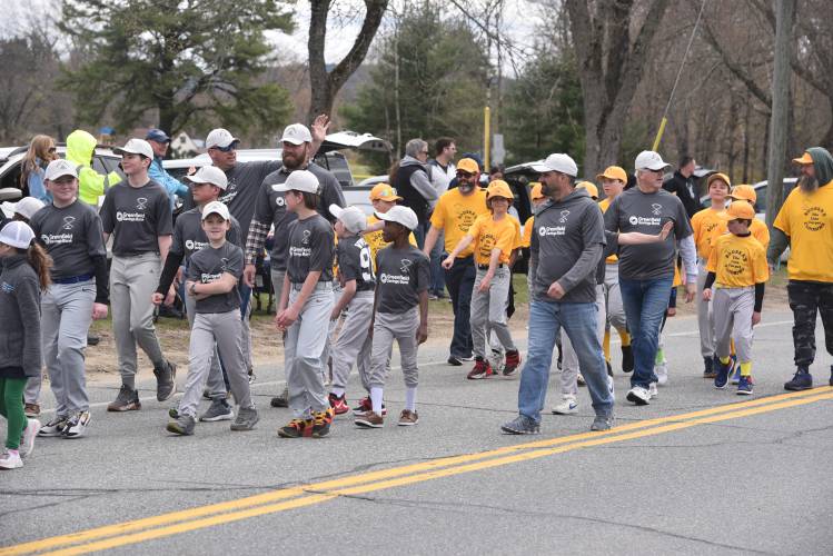 Newt Guilbault players make their way to the Newt Guilbault Fields during Sunday’s Opening Day parade.