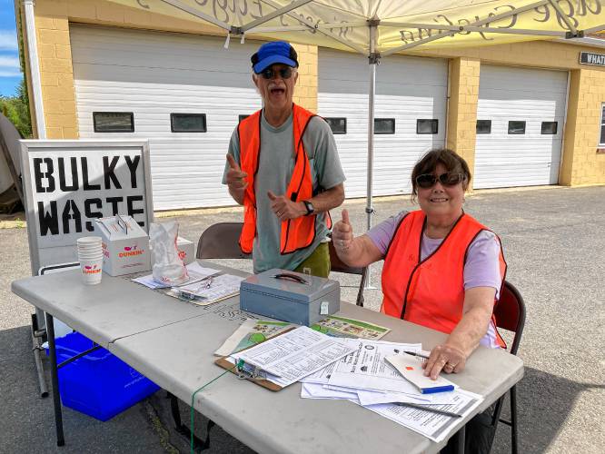 At the May 2022 “Clean Sweep” Bulky Waste Recycling Day at the Whately Transfer Station, volunteers Fran Fortino and Linda Talbot keep things organized at the check-in table.