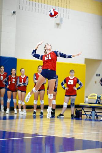 Frontier’s Olivia Machon (21) serves against Baystate Academy in the third set of the Western Mass. Class B girls volleyball final Saturday at Chicopee Comp.