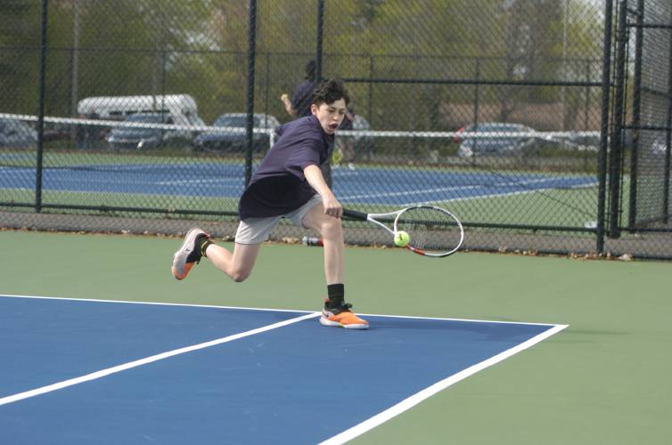 Frontier's Caiden Manning returns a volley during a No. 2 singles match against Turners' Noah Kolodziej last spring in Turners Falls. 