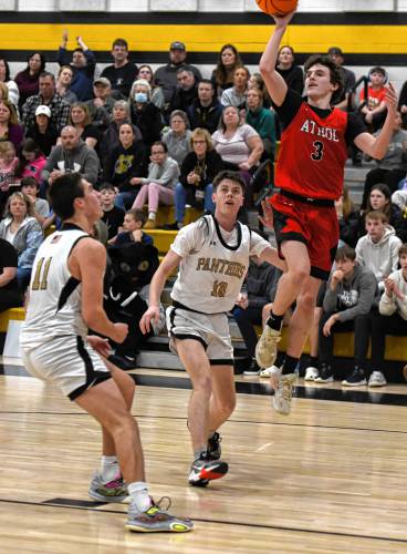 Athol’s Ethan Bacigalupo (3) pulls up for a runner in the lane while defended by Pioneer’s Brayden Thayer (10) and Hugh Cyhowski (11) during the host Panthers’ 42-32 victory in the MIAA Division 5 Round of 16 on Tuesday night at Messer Gymnasium in Northfield.