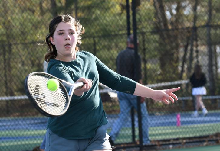 Turners Falls’ Olivia Wolbach returns a volley in Montague last spring.  
