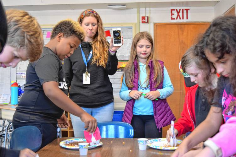 Buckland-Shelburne Elementary School teacher Jackie Fuller explores different “beak” designs with her fourth-grade class, symbolizing different types of birds. They put their beaks to the test by trying to pick up different foods, learning about the advantages of the different designs.