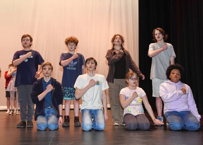 Some of the cast of “Frozen Jr.” on stage during rehearsal at Ralph C. Mahar Regional School in Orange.
