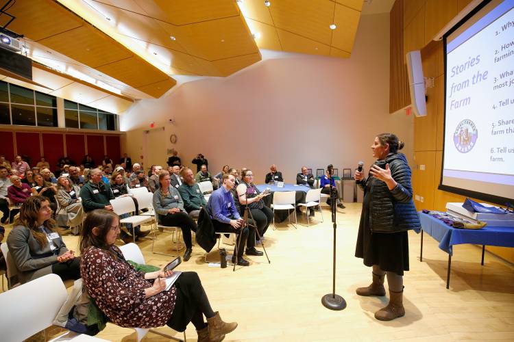 Julia Coffey of Mycoterra Farm in South Deerfield speaks during the annual Farmer Appreciation Party held by the Harold Grinspoon Foundation on Wednesday evening at the Smith College Campus Center in Northampton.
