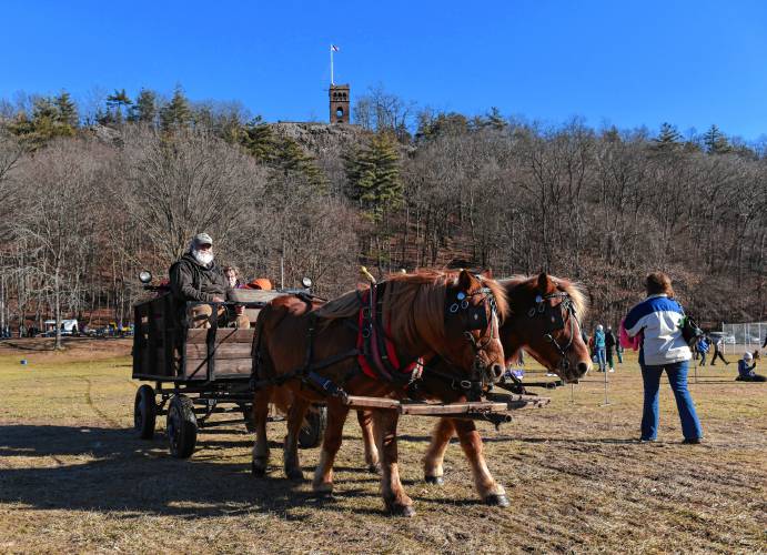 Horse-drawn wagon rides at Beacon Field on Sunday during the 102nd annual Winter Carnival in Greenfield.
