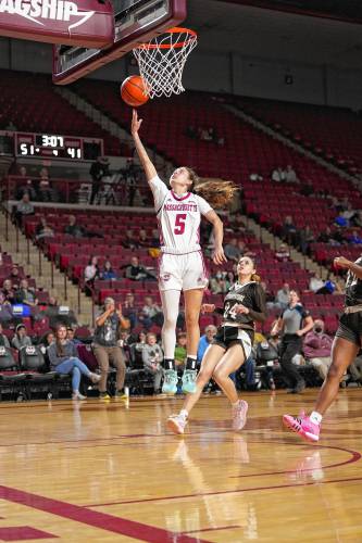  Kristin Williams (5) glides in for an easy two during UMass’ 58-45 win over St. Bonaventure on Wednesday night at the Mullins Center.