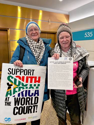 Sherrill Hogen, left, of Charlemont, and Paki Wieland, of Greenfield, were accompanied by (not pictured) Dorothea Melnicoff, also of Greenfield, and Priscilla Lynch, of Conway, in Boston as part of an effort by a coalition of peace organizations calling on nation-states to unite with South Africa in charging Israel with genocide for its actions in Gaza.