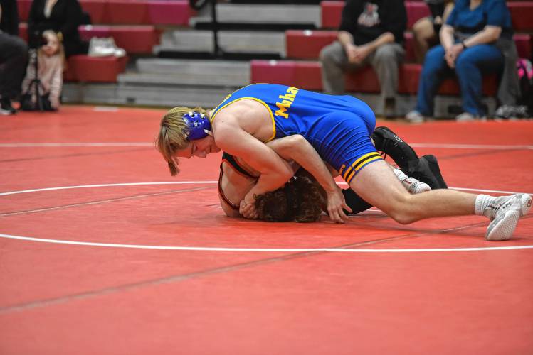 Mohawk Trail’s Logan Moore attemps to secure a pin against Athol’s Brady O’Connell on Tuesday at Mallet Gymnasium.