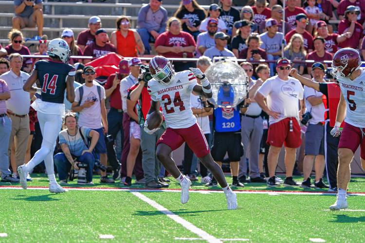 UMass' Michael Oppong celebrates after a first quarter interception against New Mexico State in Las Cruces, N.M. on Saturday.
