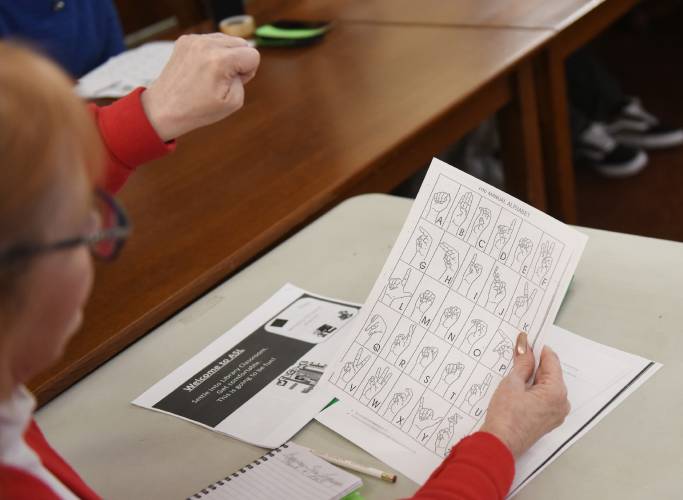 Students learn American Sign Language during a class at the Sunderland Public Library last year. The Education Committee gave a favorable report to and recommended passage of a measure that would require that American Sign Language be taught in all public elementary and secondary schools.
