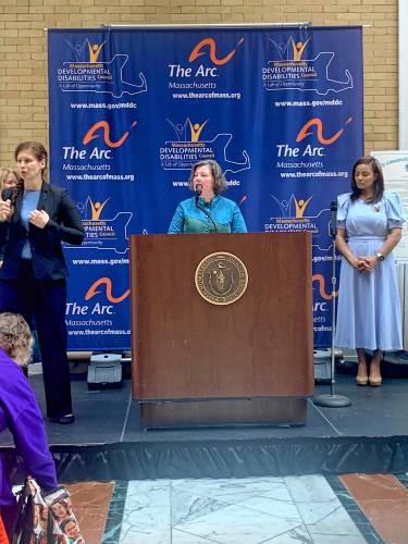 Sen. Jo Comerford, at the podium, speaks during the Massachusetts Developmental Disabilities Council’s Legislative Advocacy Day at the State House earlier this month. At right is Raquel Quezada, chair of the council.