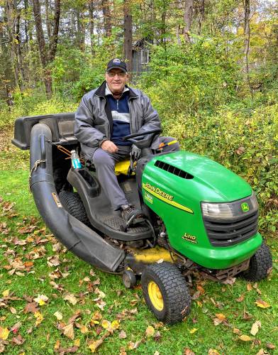 Russ Flagg saw a way to be helpful and mows the lawn for an elderly neighbor.