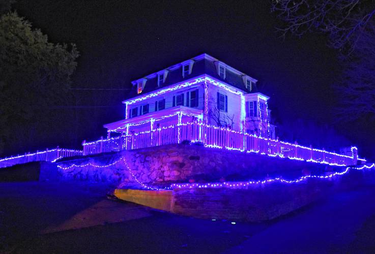 This house in Gill is outlined in blue lights.