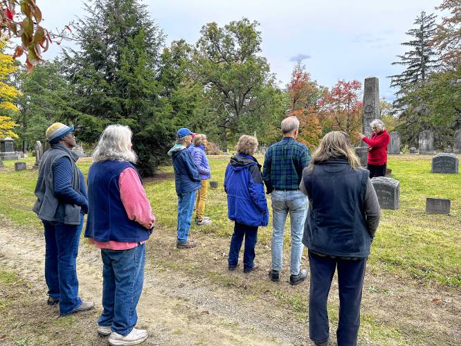 Historical Society President Carol Aleman, in red at right, leads a walking tour of Green River Cemetery focusing on late Greenfield residents who supported the anti-slavery and abolition movements.