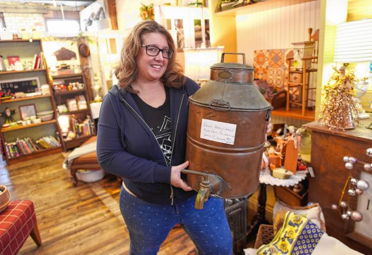 Skye Wellington with her copper boiling pot, which she attempted to sell on the reality TV show “Pawn Stars Do America,” at Innovintage Place on Hope Street in Greenfield.