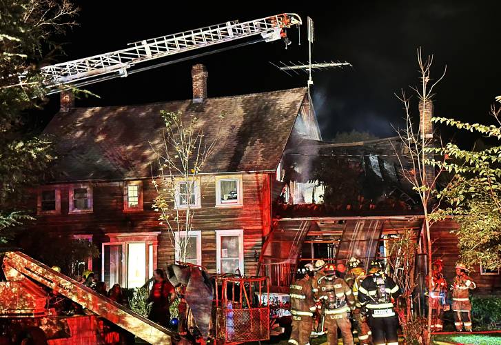 Firefighters battle the house blaze at 3014 Shelburne Falls Road in Conway on Oct. 14.