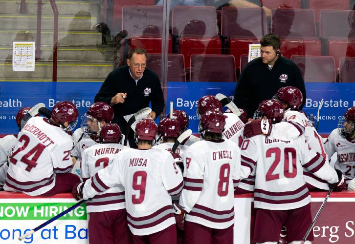 UMass head coach Greg Carvel talks with his team in the first period against AIC earlier this season at the Mullins Center in Amherst.