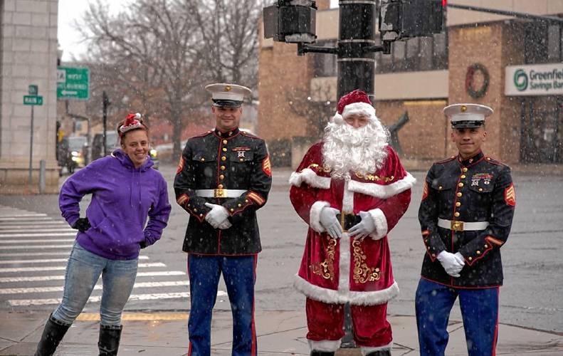 Athol resident Heather Taylor, at left, with Santa Claus and two U.S. Marine Corps Reserve members at the 2021 Giving Back Together Toy Drive collection on the Greenfield Common. Taylor started the toy drive in 2013 to help ensure no child goes without a present on Christmas morning.