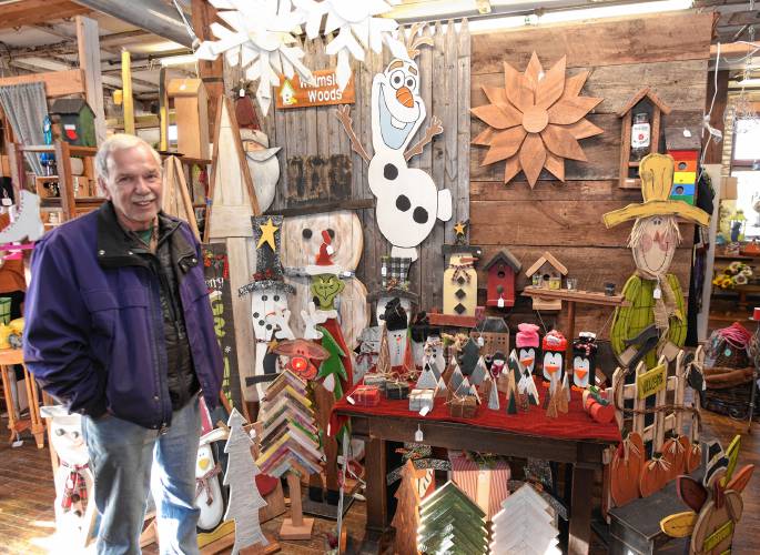 Vendor Ed Bourbeau with his Whimsical Woods products at Innovintage Place on Hope Street in Greenfield. Bourbeau sold a set of bagpipes for $800 on the reality TV show “Pawn Stars Do America.”