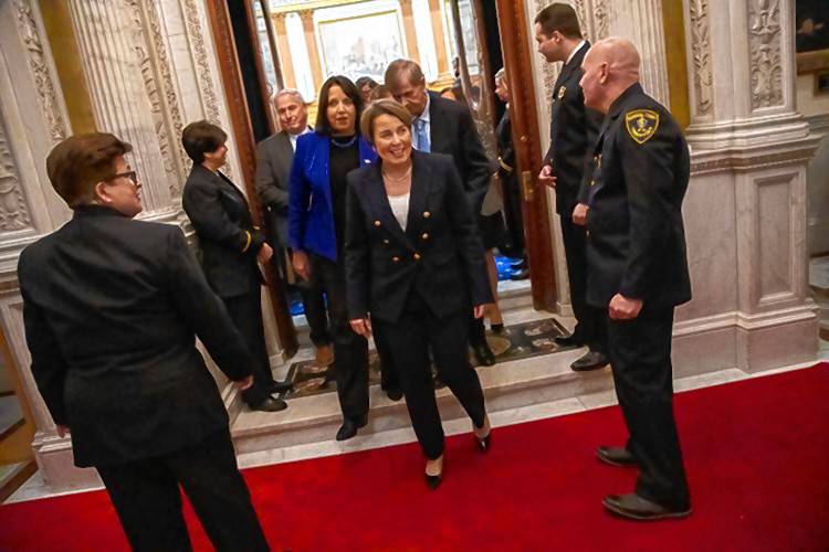 Gov. Maura Healey exits the House Chamber on Wednesday after delivering her State of the Commonwealth speech to lawmakers.