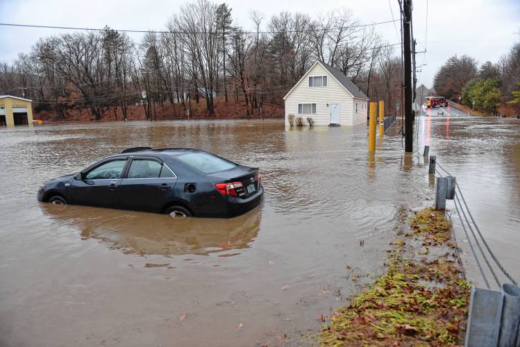 The Green River floods at the Clayton D. Davenport construction company on Colrain Street and Woodard Ave in Greenfield in December.