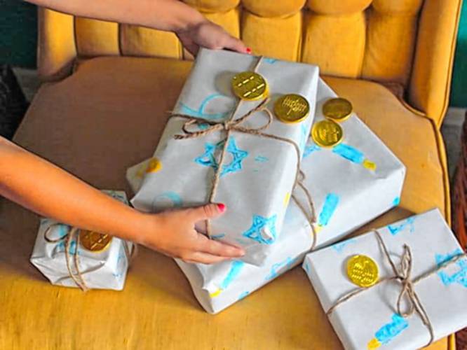 An online tutorial by Tori Avey shows how to make Hanukkah gift wrap with homemade potato stamps.