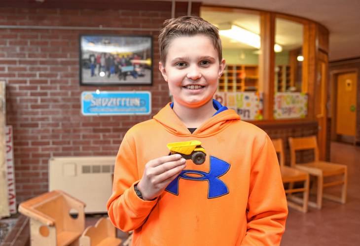 Buckland-Shelburne Elementary School sixth grader Grayson Johnson got to name a Massachusetts Department of Transportation snowplow as part of a second annual contest. His winning name was Edward Blizzardhands.