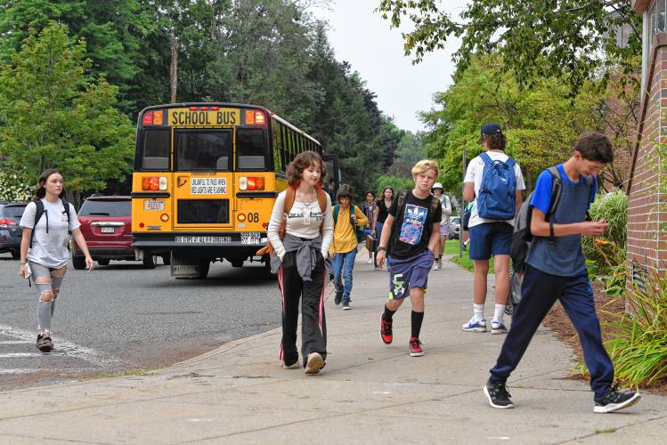 Students arrive for the first day of school at Frontier Regional School in South Deerfield on Tuesday. 