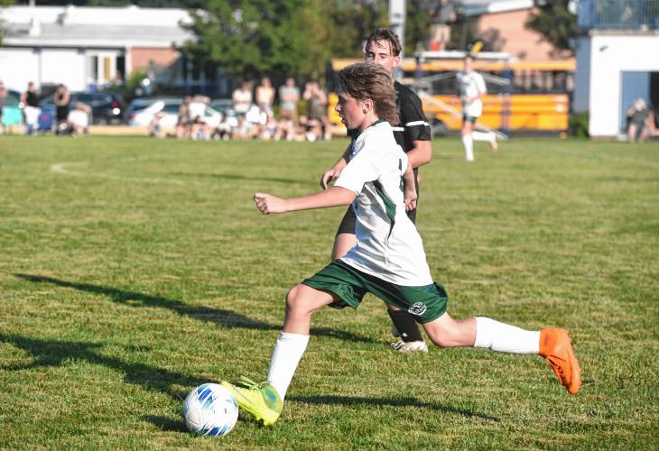 Greenfield’s Cody Yetter (6) dribbles the ball through the Pioneer midfield during the first half of action in Northfield on Wednesday.
