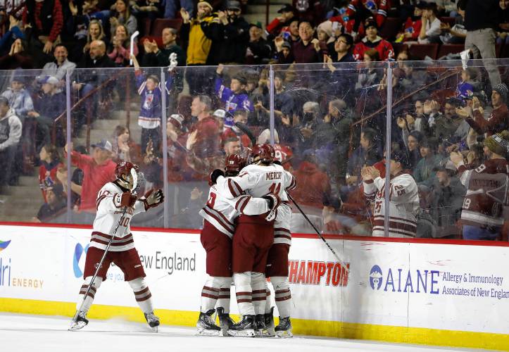 Umass players celebrate a second period goal against Boston College on Friday night at the Mullins Center.
