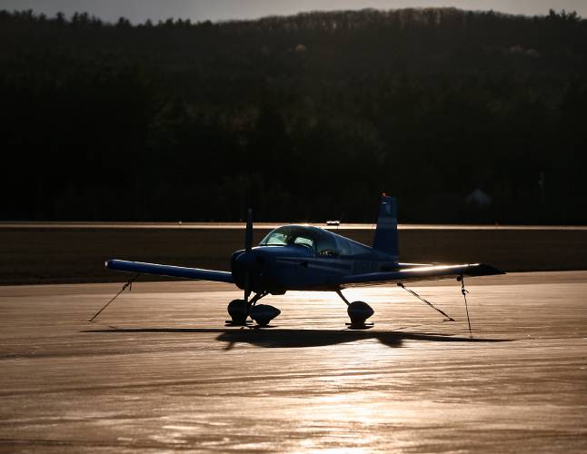 Afternoon sunlight gleams off the runway at the Orange Municipal Airport.
