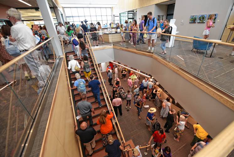 People pour into the new Greenfield Public Library after the grand opening in July.