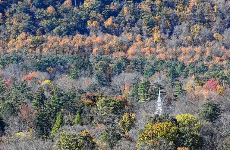 A church and hills in Shelburne Falls amid lackluster foliage this year.