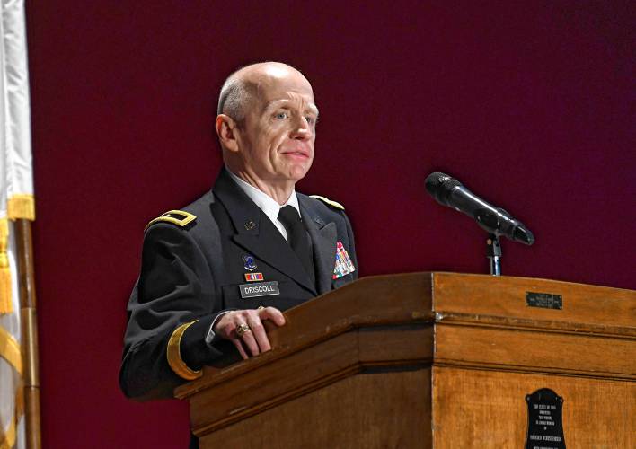 Retired Massachusetts National Guard Brig. Gen. John Driscoll speaks during a Veterans Day assembly at Ralph C. Mahar Regional School in Orange on Thursday.